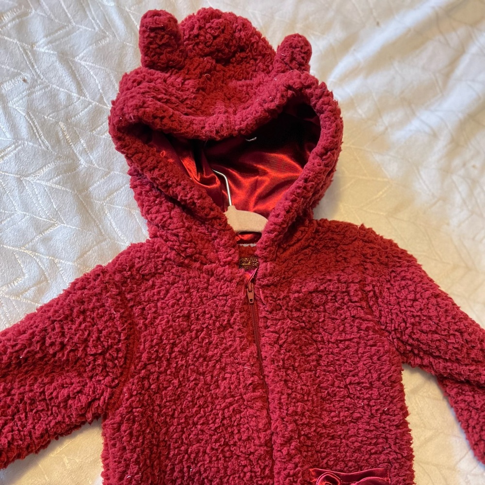 Fleece & satin hoodie to be protective and gentle on baby head. Very warm18mths